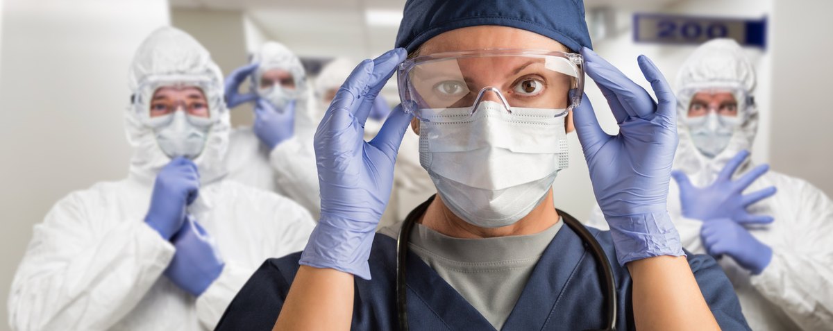 Team in protective gear in a hospitality services environment